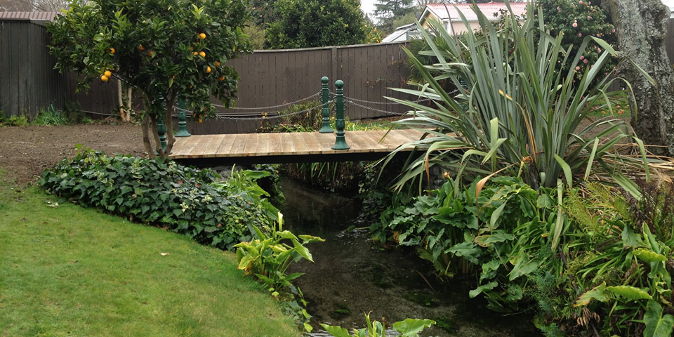 Side view of completed wooden bridge built by Marlborough Turf Pro NZ